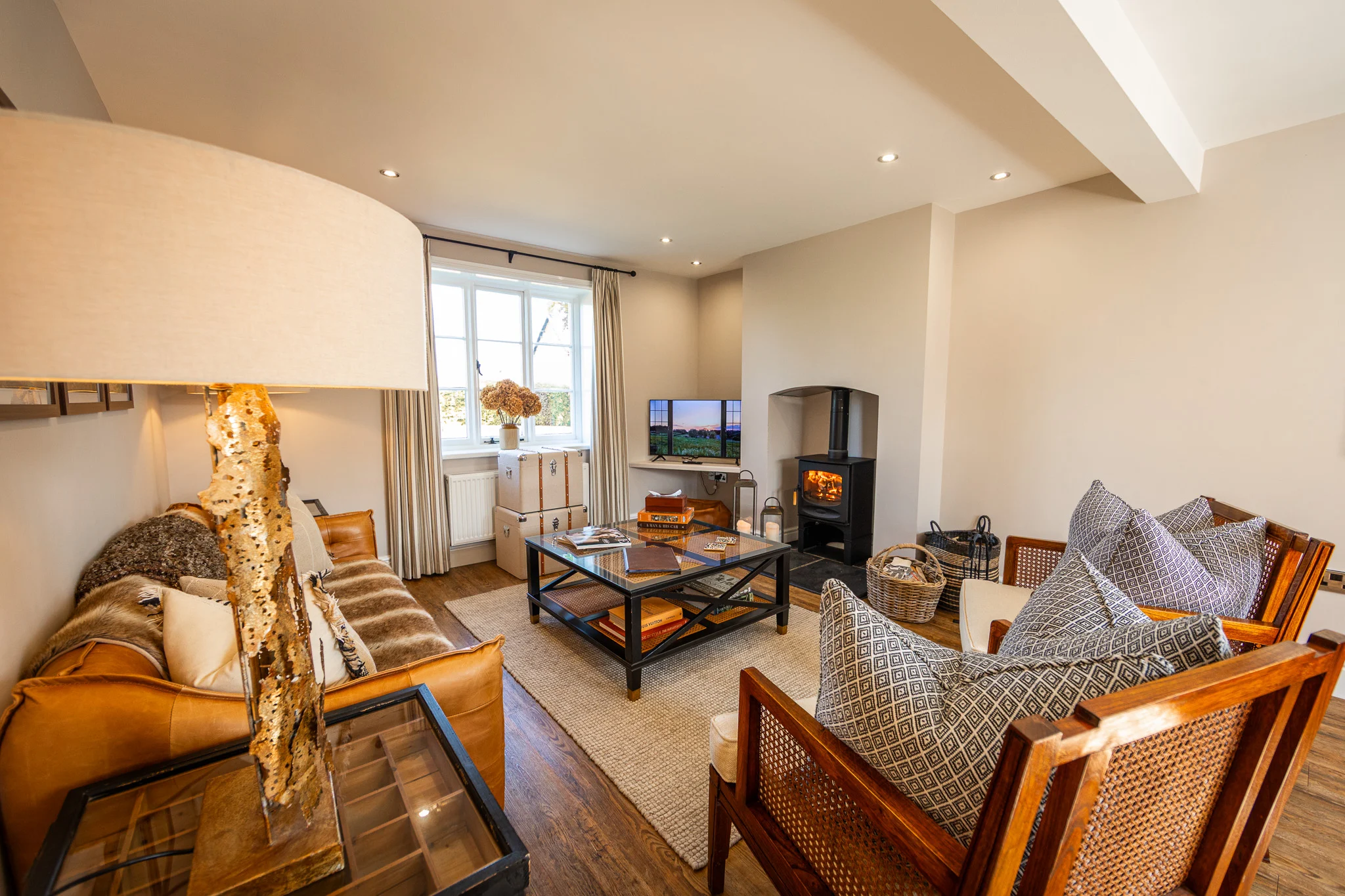 Pheasant Cottage Livingroom Living room at Pheasant Cottage, Peplow Hall Estate with wood-burning stove, comfortable seating and warm country house interiors.